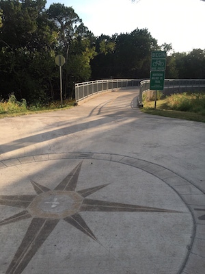 Bike path with compass rose at Walnut Creek Park in Austin