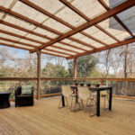 outdoor seating on deck at Top Trip Rentals' University Hills vacation rental home