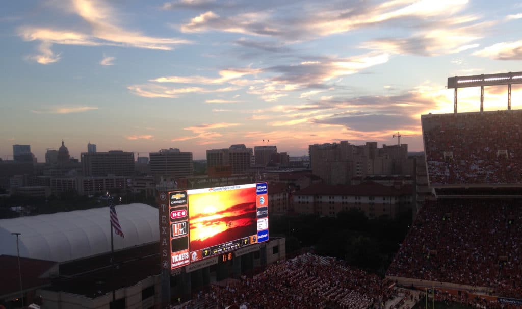 Jumbotron showing sunset at University of Texas football game